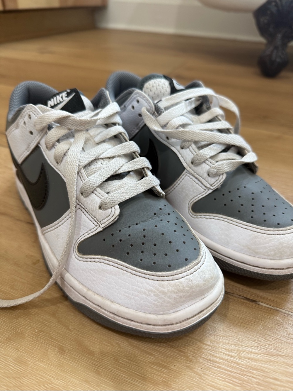 Nike Kids Low-Top Sneakers in White, Gray, and Black